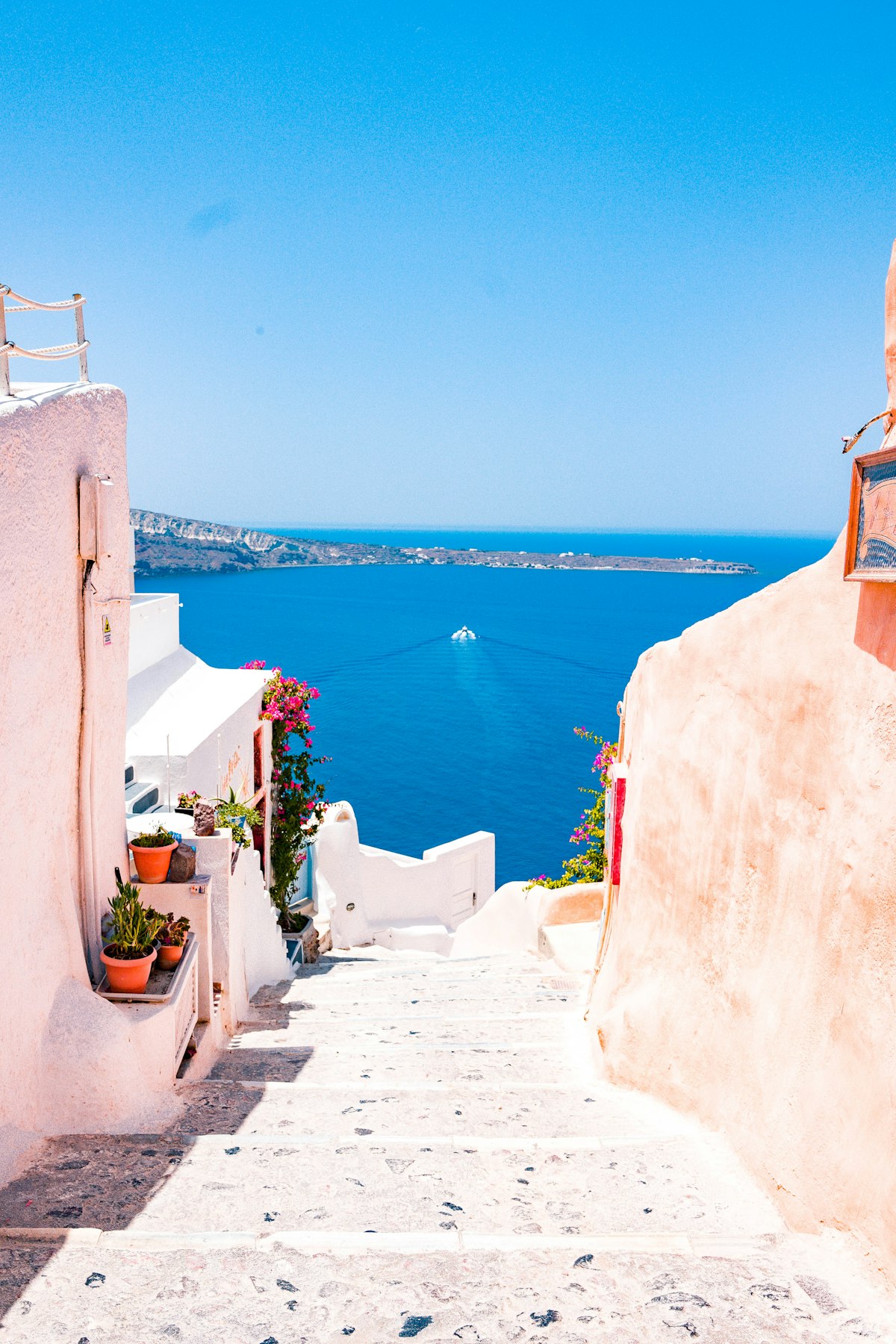 Colourful neoclassical houses along the harbour of Emporio, Halki island
